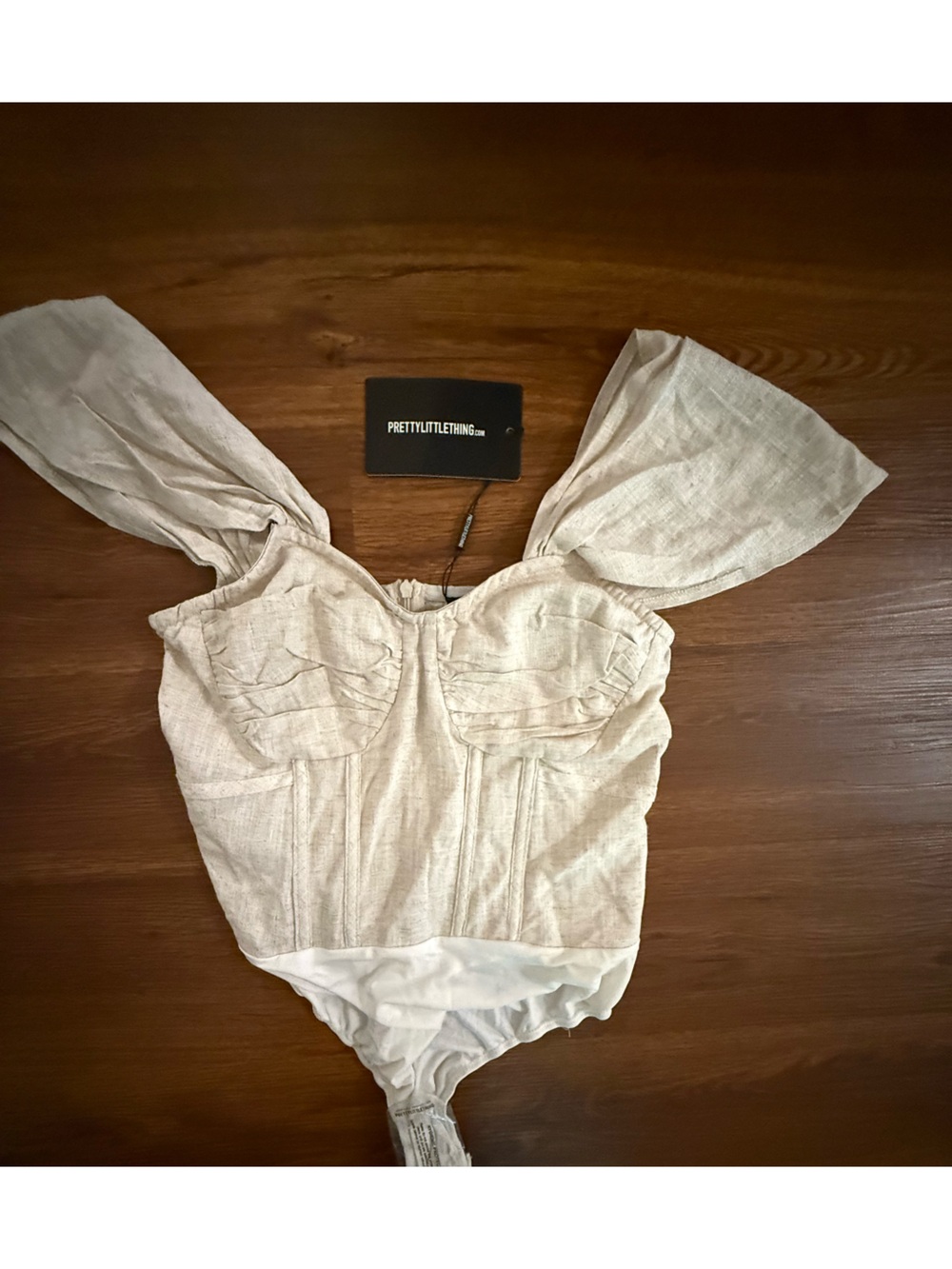 PrettyLittleThing Cream Ruffle Shoulder Linen-Blend bodysuit
